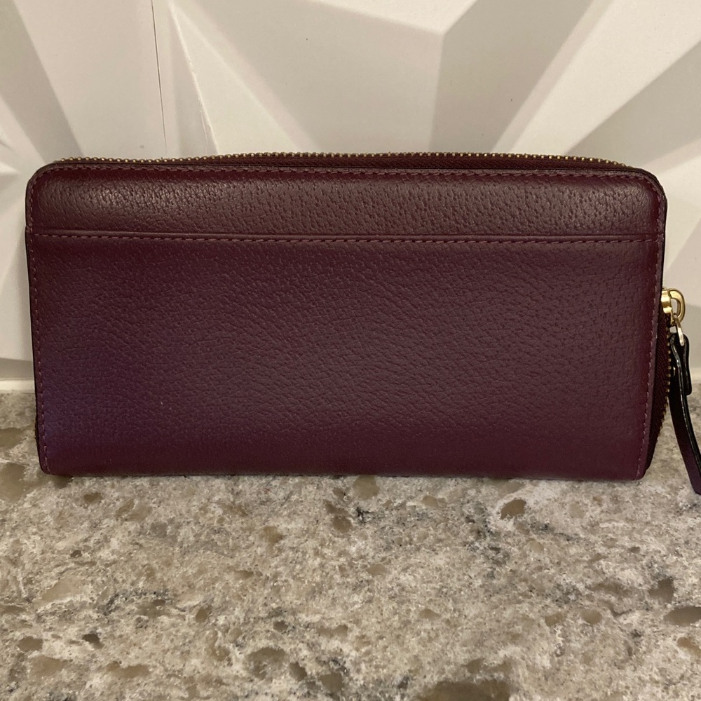 Kate Spade top zip maroon wallet
EXCELLENT CONDITION I have matching crossbody - Picture 7 of 7